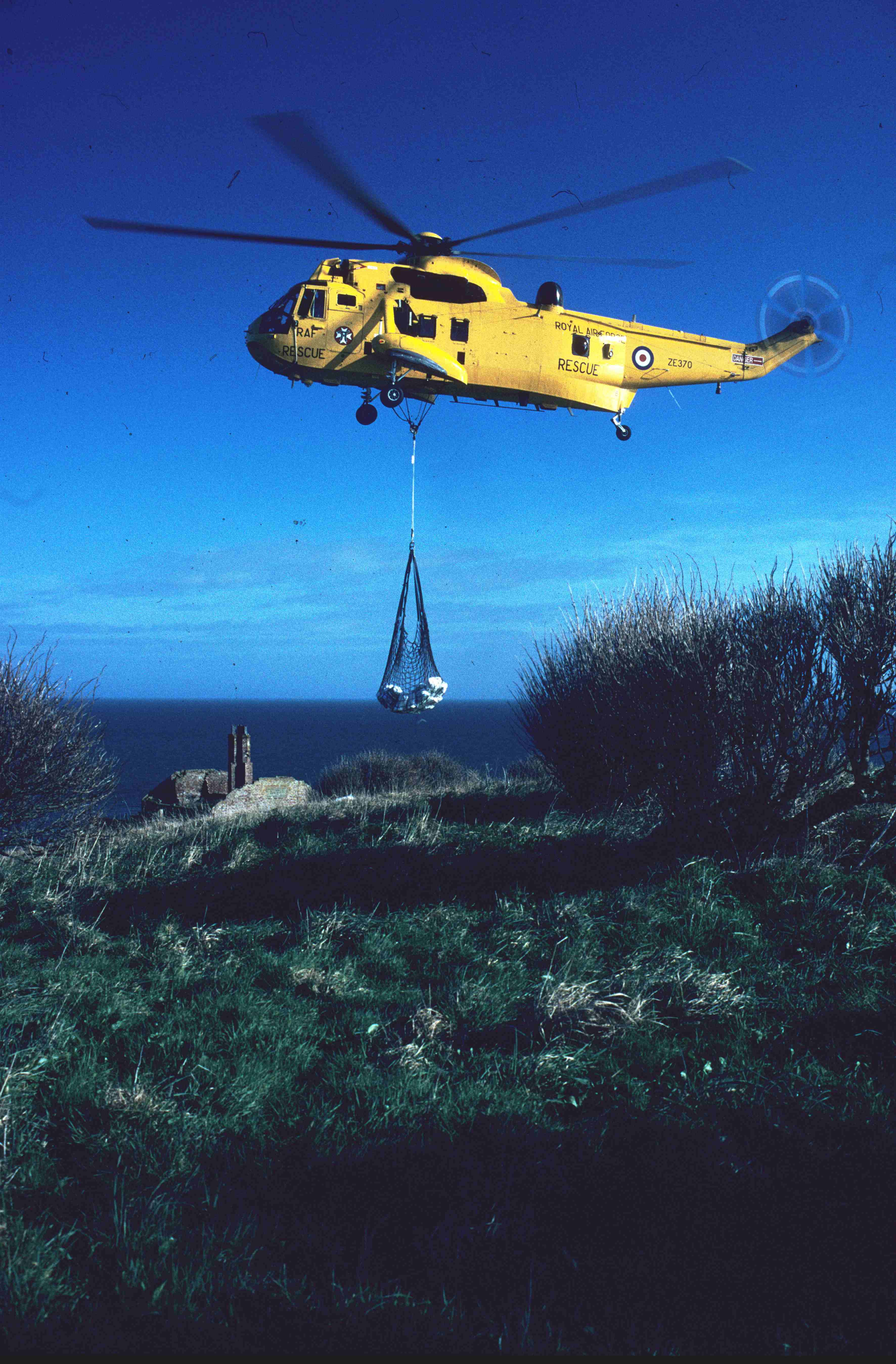 Helicopter delivery of second tonne of bait. Copyright: J B Ratcliffe1998